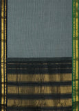 Athena is a traditional Gadwal cotton in cloud grey with pure silk Ganga-Jamuna borders in forest green and black and pure silk plain black. Pure zari only has been used.