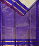 Aphrodite is a traditional Gadwal cotton in plain rice white with silk borders and silk palla in violet.