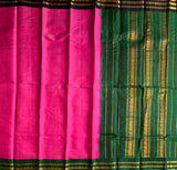 Gulaabi is a traditional Gadwal cotton in rose pink with pure silk Ganga-Jamuna borders in forest green and black and pure silk palla in green.