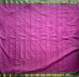 Snigdha is a traditional Gadwal cotton in orchid purple with silk-cotton borders in gren and cotton palla in pink.