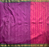 Snigdha is a traditional Gadwal cotton in orchid purple with silk-cotton borders in gren and cotton palla in pink.