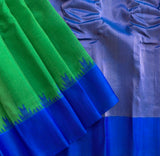 Indreyi is a Gadwal cotton-silk in a lovely parrot green with a brilliant blue silk border and a pure jari pallu.  The border and pallu are in pure silk attached to the separately woven cotton body of the saree using the 'kuttu' technique.