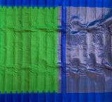 Indreyi is a Gadwal cotton-silk in a lovely parrot green with a brilliant blue silk border and a pure jari pallu.  The border and pallu are in pure silk attached to the separately woven cotton body of the saree using the 'kuttu' technique.