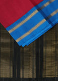 Eos is a traditional pinkish red Gadwal cotton with pure Ganga-Jamuna silk borders in cyan blue and black and pure silk black palla. Pure zari has been used in this authentic handloom Gadwal. 