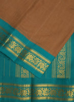 Body of the Sepia handwoven gadwal cotton saree with sea green coloured pure silk borders. The palla is pure silk too. Pure zari has been used in hand-weaving this saree. These sarees are now a rare find and are an heirloom weave. Shop this vintage weave now! 