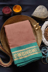 Sepia handwoven gadwal cotton saree with sea green coloured pure silk borders. The palla is pure silk too. Pure zari has been used in hand-weaving this saree. These sarees are now a rare find and are an heirloom weave. Shop this vintage weave now! 