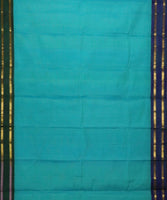 Demeter is a sea-green Gadwal cotton with pure silk borders in Ganga-Jamuna style in peacock blue and peacock green. It has a pure silk palla in peacock blue and pure zari has been used throughout.