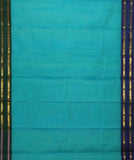 Demeter is a sea-green Gadwal cotton with pure silk borders in Ganga-Jamuna style in peacock blue and peacock green. It has a pure silk palla in peacock blue and pure zari has been used throughout.