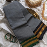Athena is a traditional Gadwal cotton in cloud grey with pure silk Ganga-Jamuna borders in forest green and black and pure silk plain black. Pure zari only has been used.