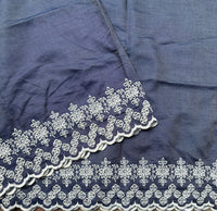 Off duty denim saree with intricate cutwork border