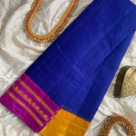 Ahalya is a traditional Gadwal cotton in bright MS Blue with pure silk Ganga-Jamuna borders in orchid and mustard and pure silk palla in mustard. The bright colour combinations give a very festive look to the saree.