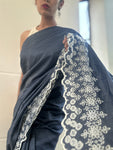 Off duty denim saree with intricate cutwork border