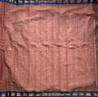 Ahalya is a traditional Gadwal cotton in a rosy brown with silk-cotton borders in cyan blue and simple cotton palla. 