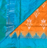 Yaami - Handwoven double ikat silk in orange and cyan