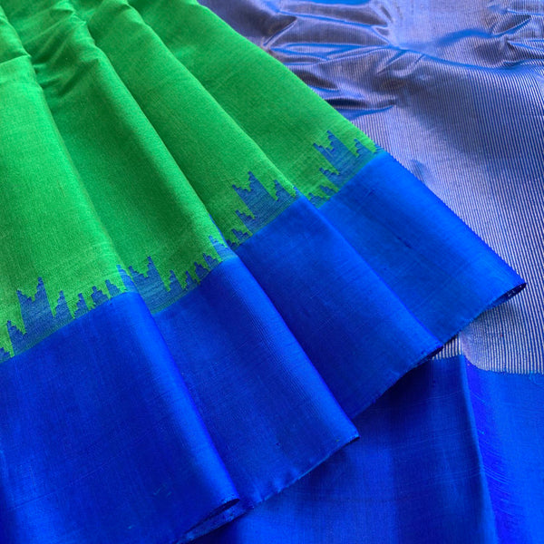 Indreyi is a Gadwal cotton-silk in a lovely parrot green with a brilliant blue silk border and a pure jari pallu.  The border and pallu are in pure silk attached to the separately woven cotton body of the saree using the 'kuttu' technique.