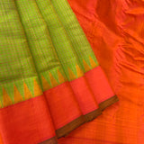 Lasya is a Gadwal cotton-silk in a shot coloured green-yellow with a sunset orange border and an orange silk pallu.  The border and pallu are in pure silk attached to the separately woven cotton body of the saree using the 'kuttu' technique